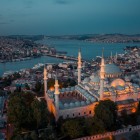 A drone view of the Süleymaniye Mosque, with the Bosphorus Bridge and channel in the background