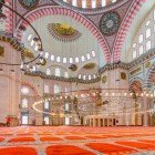 The floor of the Suleymaniye Mosque in Istanbul is covered with fine carpets, contributing to the serene and sacred atmosphere of the place.