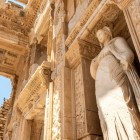 The Library of Celsus in Ephesus is adorned with statues representing wisdom, knowledge, intelligence, and virtue, symbols of ancient Roman knowledge.