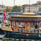 On the Galata Bridge in Istanbul, balık ekmek restaurants offer the traditional fresh fish sandwich, amid scenic views and a lively atmosphere.