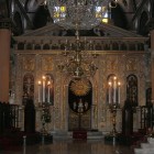 The interior of the church is richly adorned. On the right side, near the middle of the nave, there is a pulpit, while at the end, there is an ornate iconostasis.