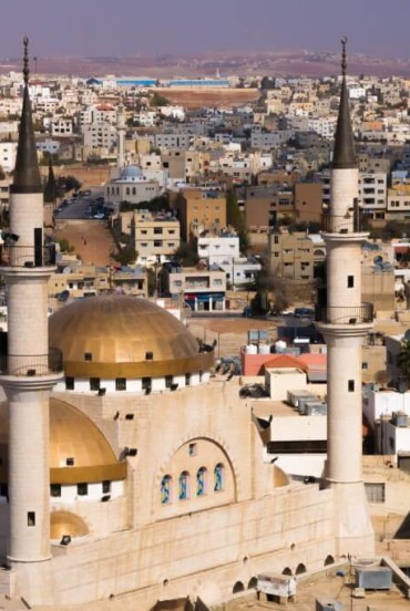 Madaba, a Jordanian city known for its mosques and ancient mosaics, a unique mix of history, culture, and vibrant urban life.