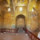 Interior of the ancient Umayyad desert castle of Qasr Amra with Roman murals and ceiling decorations in Zarqa, Jordan