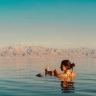 Relaxing time with a bath in the waters of the Dead Sea in Jordan