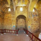 Interior of the ancient Umayyad desert castle of Qasr Amra with Roman murals and ceiling decorations in Zarqa, Jordan