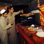 Bedouin typical cuisine based on meat and vegetables prepared in tents in the Wadi Rum desert in Jordan