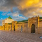 The Mausoleum of Mohammed V in Rabat, an Arab-Andalusian masterpiece in white marble, houses the royal tombs and symbolizes Moroccan independence.