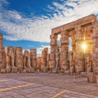 Ancient Luxor Temple, standing statues of Ramses II, ruins of the first pylon, Egypt