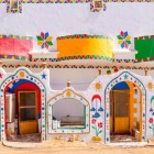 Vibrant colors and geometric patterns of a Nubian house near the temple of Abu Simbel in the Aswan Governorate of Egypt