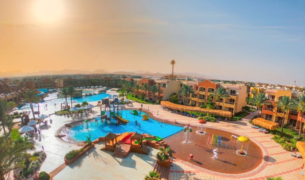 Royal Regency Club - Ultra All Inclusive - Aerial view of the Royal Regency Club’s main pool, featuring a fun-filled aquapark with colorful slides—perfect for families and relaxing moments under the Sharm El Sheikh sun.