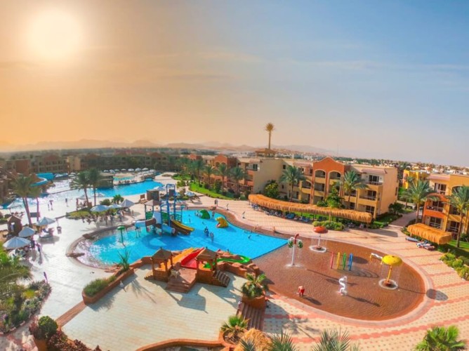 Royal Regency Club - Ultra All Inclusive - Aerial view of the Royal Regency Club’s main pool, featuring a fun-filled aquapark with colorful slides—perfect for families and relaxing moments under the Sharm El Sheikh sun.