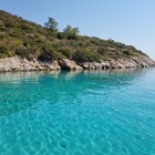 Aquarium Bay: a glimpse of the crystal-clear and unspoiled waters of the bay — an ideal and highly recommended spot for an unforgettable swim