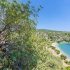 One of the beautiful coves of Mazi Bay, on the Aegean Sea, characterized by crystal-clear waters and fine golden sand, is the perfect place to swim, snorkel, or simply relax in the sun.