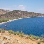 Surrounded by hills and cliffs, the coastline offers breathtaking landscapes, making it a perfect place for relaxation and nature exploration.