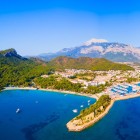Kemer, located on the Mediterranean coast of Turkey, is a vibrant tourist destination famous for its sandy beaches, crystal-clear waters, and mountain views. It offers a mix of relaxation, history, and outdoor activities.