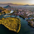 The Dalyan River flows peacefully between mountains and lush vegetation, offering breathtaking views of rock-carved tombs and serene landscapes. Navigating it is a unique experience that blends history and nature