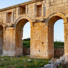 The Arch of Mettius Modestus, dating back to the 1st century AD, with its three majestic limestone arches, marked the official entrance to Patara, welcoming travelers from the port and inland.