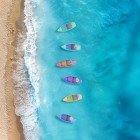 Typical Turkish colorful boats anchored along the beautiful Çıralı beach in the Kemer district, a famous seaside resort in the Antalya province on Turkey's Turquoise Coast.