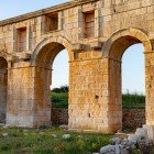 The Arch of Mettius Modestus, dating back to the 1st century AD, with its three majestic limestone arches, marked the official entrance to Patara, welcoming travelers from the port and inland.