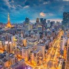 The nighttime view of central Tokyo is a dazzling display of bright lights, towering skyscrapers, and busy streets. The city lights reflect the vibrant and modern energy of this metropolis.