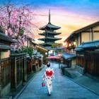In spring, the Gion district transforms with cherry blossoms. A geisha in kimono walks through the historic alleys, offering an authentic experience of traditional Japanese culture.