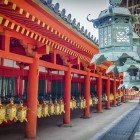 Kasuga Taisha, the most famous Shinto shrine in Nara, stands on Mount Mikasa. Known for its stone lanterns, it is dedicated to the gods Inari, deities of fertility, rice, and agriculture.