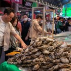 At Omicho Market in Kanazawa, a stall offers fresh oysters from the Japan Sea, served with condiments like lemon or ponzu sauce, for an authentic experience.