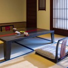 The interior of a ryokan restaurant is a perfect balance of simple elegance and traditional comfort. The wooden and rice paper (shoji) walls create a calm and intimate atmosphere.