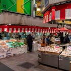 Interior view of Omicho Market, easily reachable from Kanazawa Station with a 15-20 minute walk or by JR buses, getting off at the Musashigatsuji/Omicho Market stop.