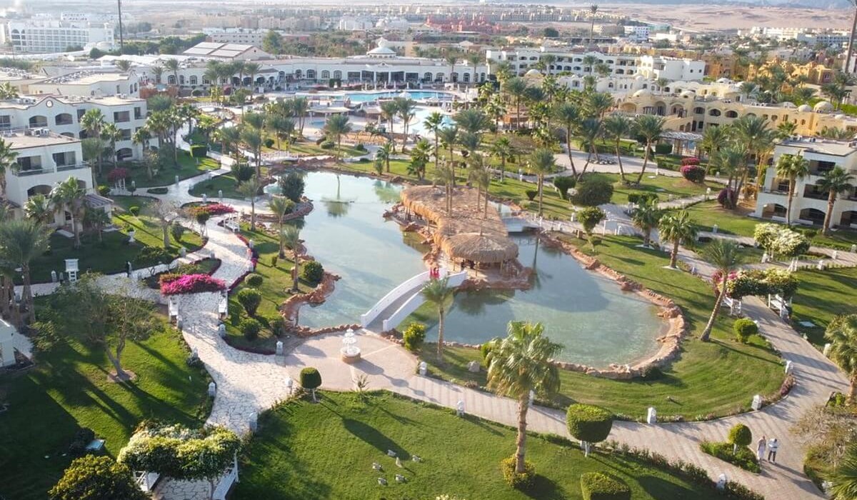 Royal Regency Club - Ultra All Inclusive - Drone aerial view of the Royal Regency Club showcasing the wide, well-kept walkways, crystal-clear pools, lush, well-maintained gardens, and the elegant resort structure.
