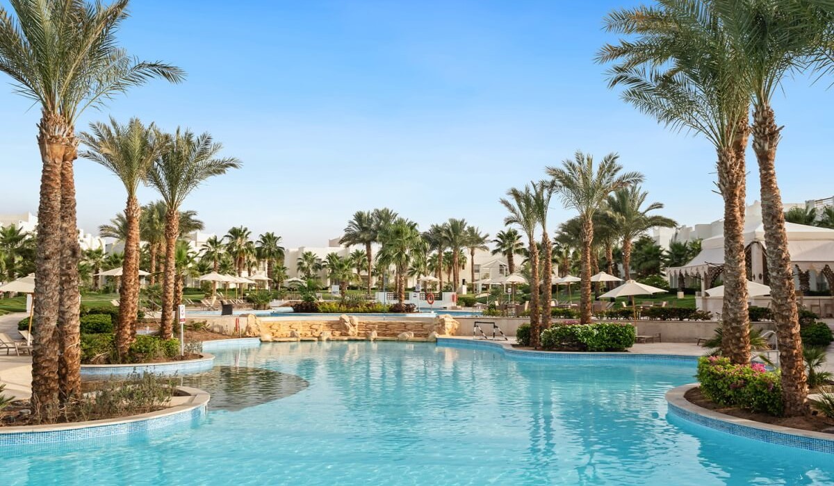 Swissôtel Sharm El Sheikh All Inclusive Collection - The pool area at Swissôtel Sharm El Sheikh All Inclusive Collection offers a wide variety of pools with varying depths, set amidst lush tropical gardens.
