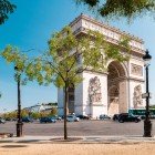 The Arc de Triomphe in Paris, grand and neoclassical, is adorned with reliefs, sculptures and inscriptions celebrating France’s victories. At its base burns the Tomb of the Unknown Soldier.