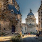 The Pantheon in Paris’ 5th arrondissement highlights the typical Parisian architecture of cobblestone streets and the beautiful historic buildings.