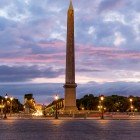 The obelisk of Place de la Concorde, an ancient Egyptian monument of pink granite, rises elegantly at the center of the Parisian square, a timeless symbol of history and splendor.