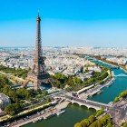 From above, admire the Seine flowing through Paris between historic bridges and lively banks, with the Eiffel Tower rising on the horizon, offering one of the city’s most iconic and romantic views.