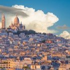 Montmartre, Paris' bohemian district, enchants with cobbled streets, artists' studios, and the Basilica of Sacré-Cœur overlooking the city with spectacular views.