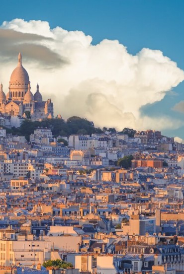 Montmartre, Paris' bohemian district, enchants with cobbled streets, artists' studios, and the Basilica of Sacré-Cœur overlooking the city with spectacular views.
