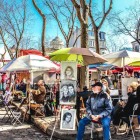 Artists, artworks and painters at work in Place du Tertre, near the Sacre Coeur in Montmartre, Paris.