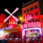 The exterior facade of the Moulin Rouge, a traditional cabaret built in 1889 by Josep Oller.