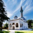 The Green Mosque in Bursa, built in 1421, is a jewel of Ottoman art, famous for its elegant green and turquoise tiles adorning the interior walls and façade.
