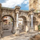 the monumental Hadrian's Gate, made of marble and dedicated to the emperor who visited the city in the year 130.