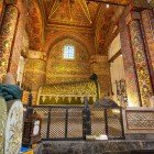 The tomb of Mevlana Rumi, housed beneath the striking Green Dome, is adorned with exquisite fabrics and ancient calligraphic inscriptions, a place of profound spirituality and Seljuk art.