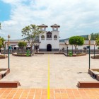The Equator line in Mitad del Mundo village near Quito, with church and local shops, an iconic Ecuador landmark where the northern and southern hemispheres meet.