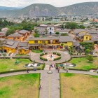 Aerial view from the Equatorial Line Monument with the Andes in the background, a symbol of Quito blending geography, culture and Ecuador’s breathtaking landscapes.