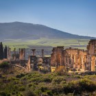 Volubilis, an ancient Roman city in Morocco, features perfectly preserved mosaics, columns, and temples, bearing witness to over two thousand years of history.