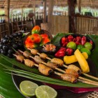 Chontacuros, or Mayones, are Amazonian larvae considered a delicacy: roasted and served on clay plates, they are enjoyed with fresh lemon, fruits, and vegetables.