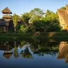 Traditional thatched lodges along the Misahuallí River in Ecuador, nestled in the Amazon rainforest: eco-friendly retreats blending simplicity, nature, and local authenticity.