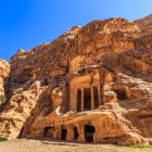 Ancient Nabatean site with rock-carved facades, set in nature. A captivating place that tells the history and art of Petra and the Nabateans.