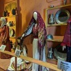 The Folklore Museum of Amman displays traditional women's clothing, hand-embroidered, symbolizing centuries-old Jordanian identity and culture.