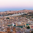 Aerial view of Fès: the ancient medina winds through alleys and minarets, offering unique glimpses of Moroccan history, culture, and architecture.